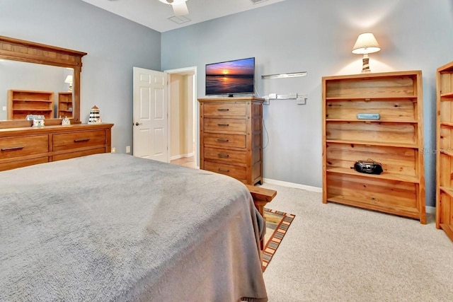 bedroom with ceiling fan and light colored carpet