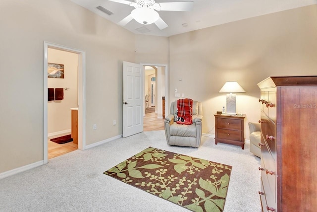 living area with carpet and ceiling fan