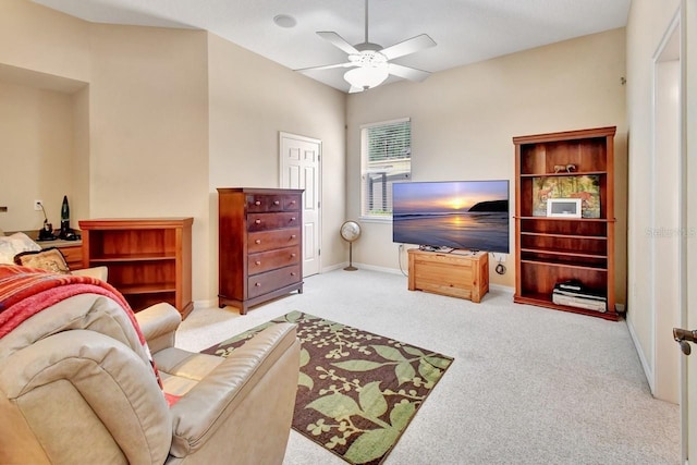 living room featuring carpet and ceiling fan