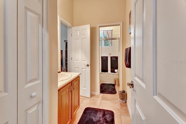 bathroom with tile floors and vanity