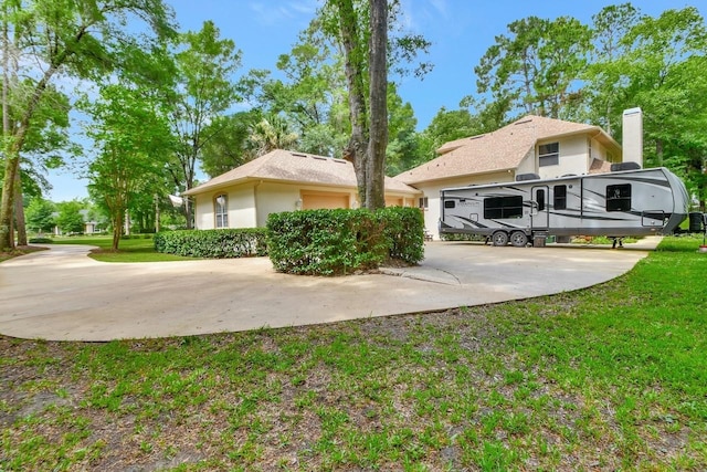 rear view of house featuring a yard