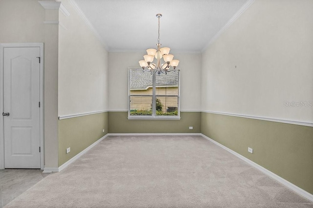 carpeted spare room featuring a notable chandelier and crown molding