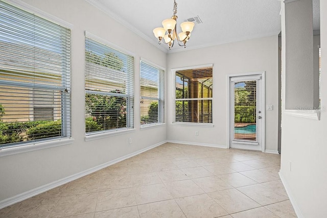 unfurnished sunroom with an inviting chandelier