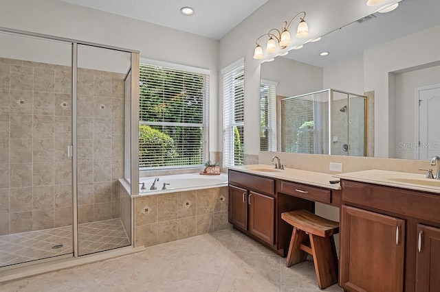 bathroom with tile patterned floors, vanity, and shower with separate bathtub