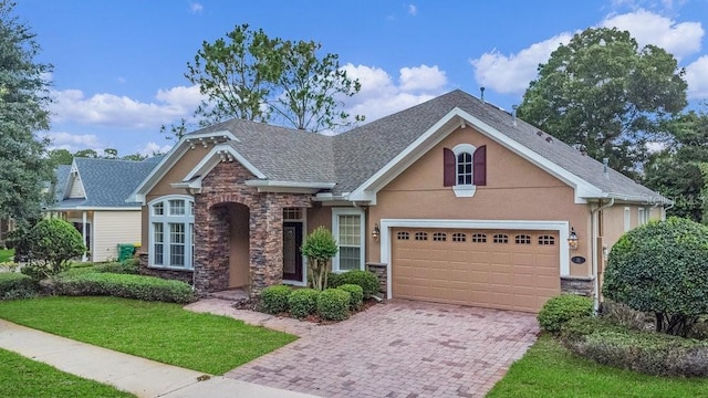 view of front facade with a garage and a front yard