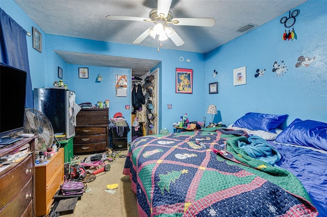 432 Marion St, Daytona Beach, FL 32114 - bedroom featuring carpet floors, a textured ceiling, and ceiling fan