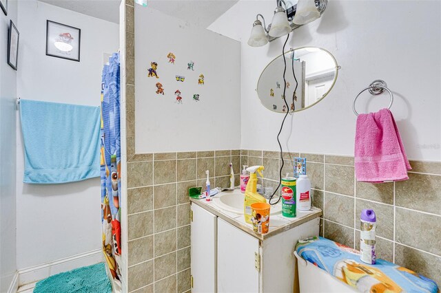 432 Marion St, Daytona Beach, FL 32114 - bathroom featuring tile walls and vanity