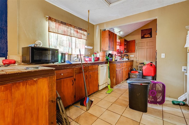 432 Marion St, Daytona Beach, FL 32114 - kitchen featuring tile counters, lofted ceiling, white dishwasher, and light tile patterned floors