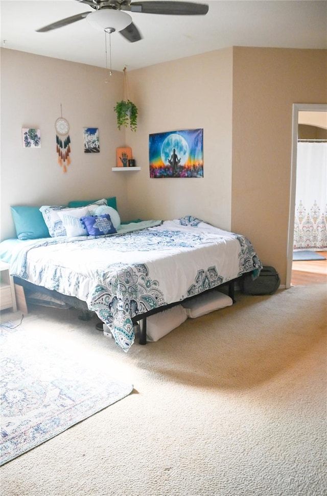 carpeted bedroom featuring ceiling fan