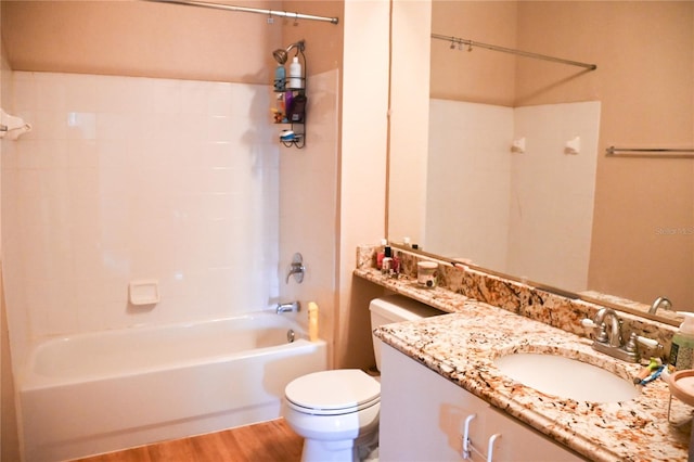 full bathroom featuring wood-type flooring, oversized vanity, toilet, and tub / shower combination