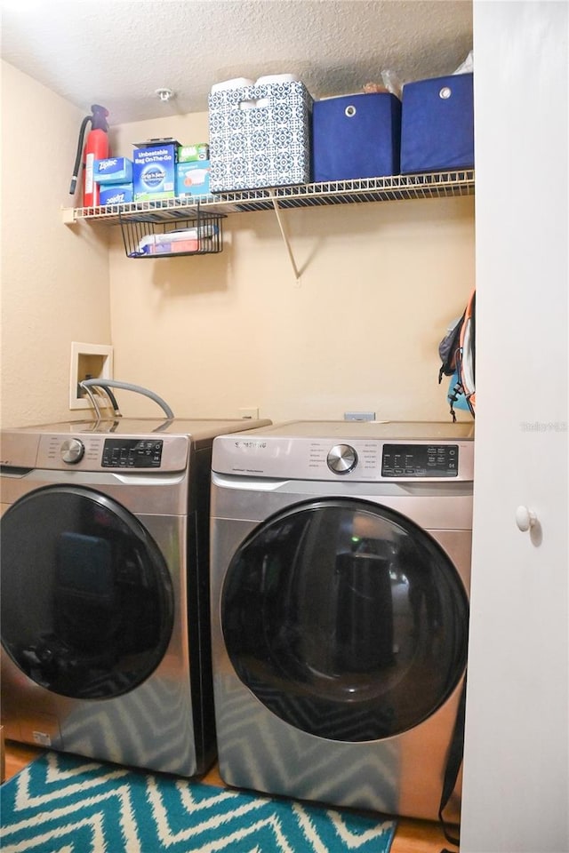 laundry area with washing machine and dryer and hookup for a washing machine