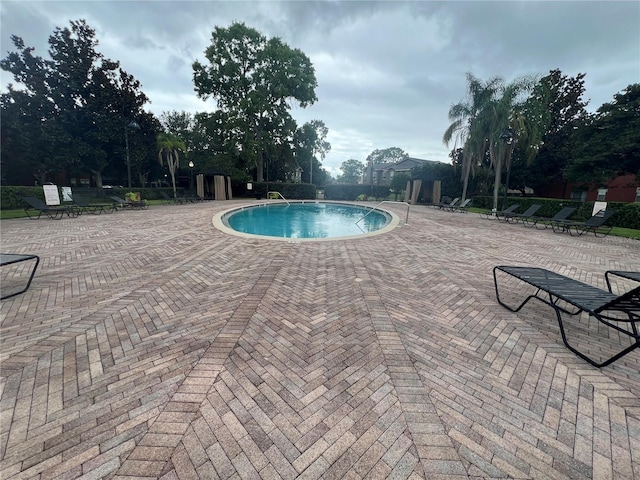 view of pool featuring a patio area