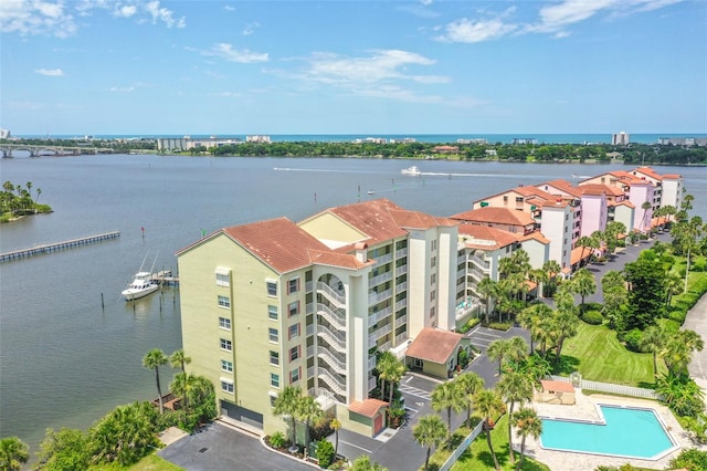 birds eye view of property with a water view