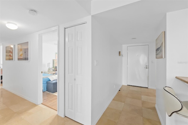 corridor with light tile patterned floors