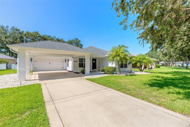 view of front of home with a garage and a front yard