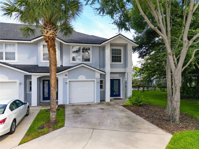 view of front of house featuring a garage and a front yard