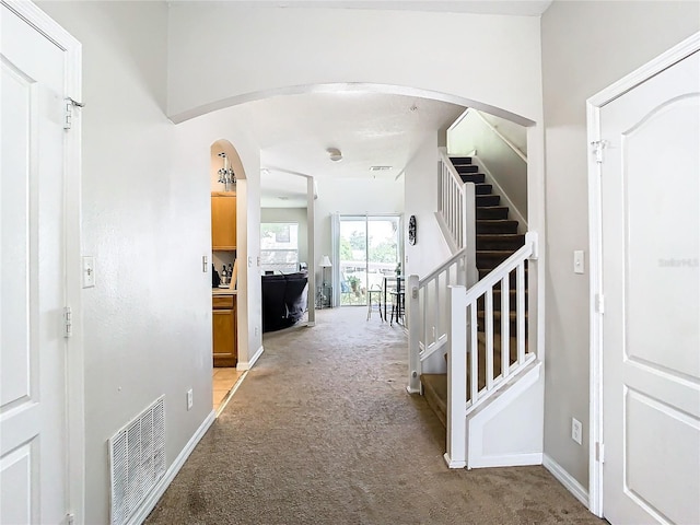 entryway with light carpet