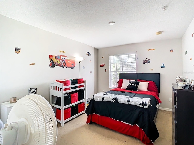 bedroom featuring a textured ceiling and carpet floors