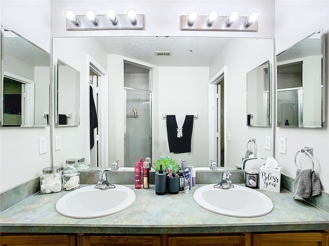 bathroom with vanity and walk in shower