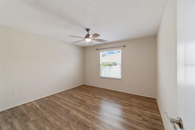 empty room featuring ceiling fan, wood-type flooring, and a textured ceiling