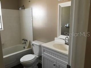 full bathroom with toilet, bathtub / shower combination, and vanity