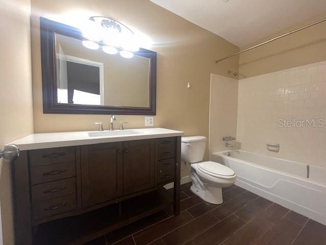 full bathroom with shower / tub combination, vanity, and toilet