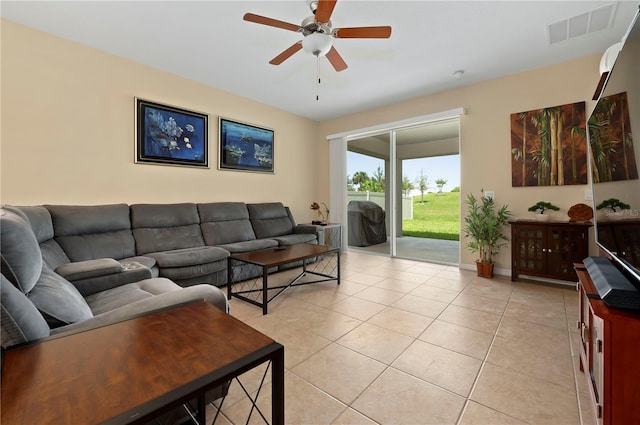 living room with light tile patterned floors and ceiling fan