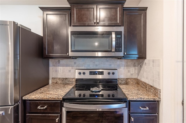 kitchen featuring backsplash, appliances with stainless steel finishes, and dark brown cabinetry