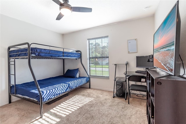 bedroom with ceiling fan and light colored carpet