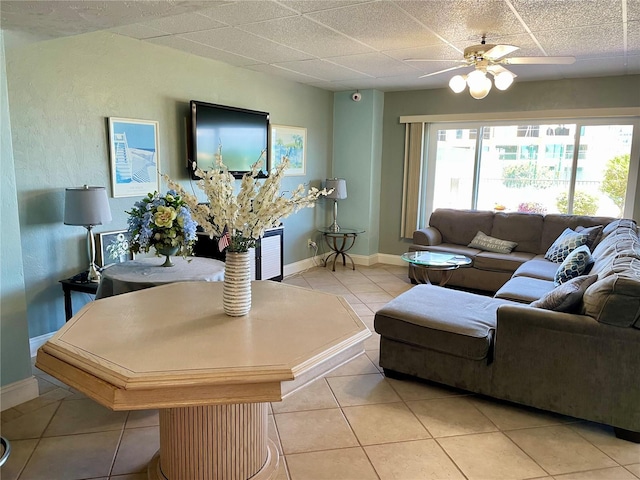 living room with light tile patterned floors and ceiling fan