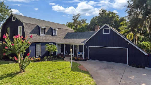 view of front of home with a garage and a front yard