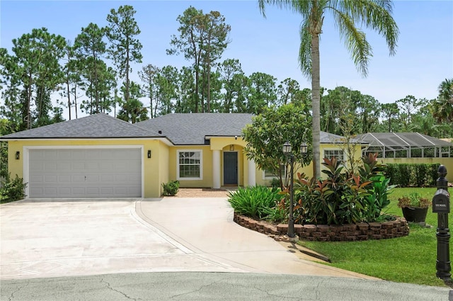 single story home with stucco siding, a shingled roof, an attached garage, a front yard, and driveway