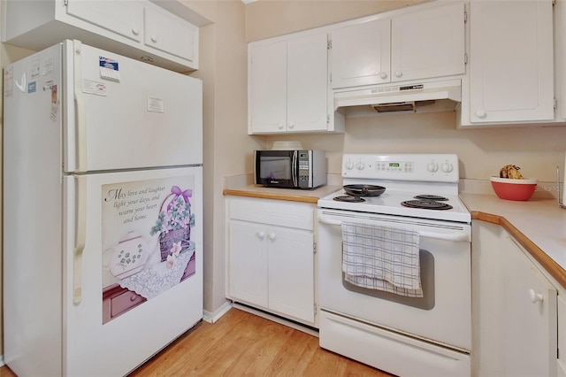 kitchen with white cabinets, white appliances, and light hardwood / wood-style floors