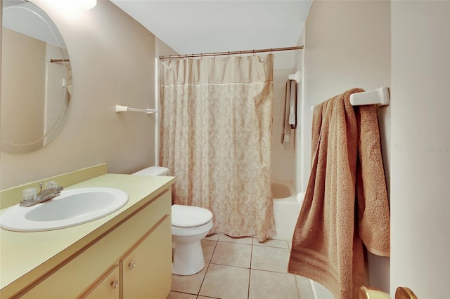 full bathroom featuring tile patterned flooring, vanity, toilet, and shower / tub combo with curtain