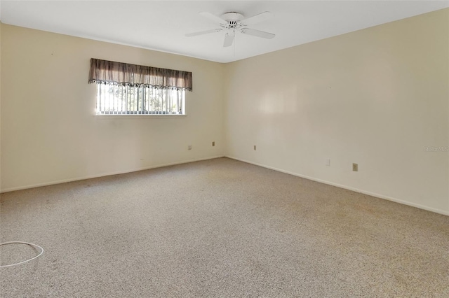 empty room featuring carpet flooring and ceiling fan