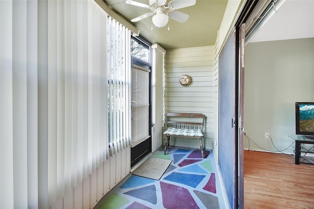 entryway featuring ceiling fan and hardwood / wood-style flooring