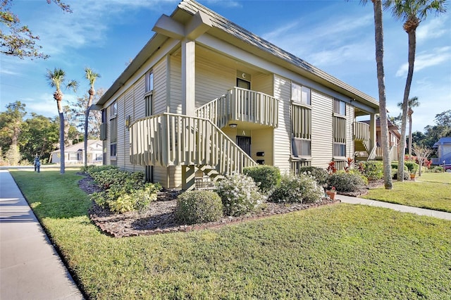 view of home's exterior featuring a yard