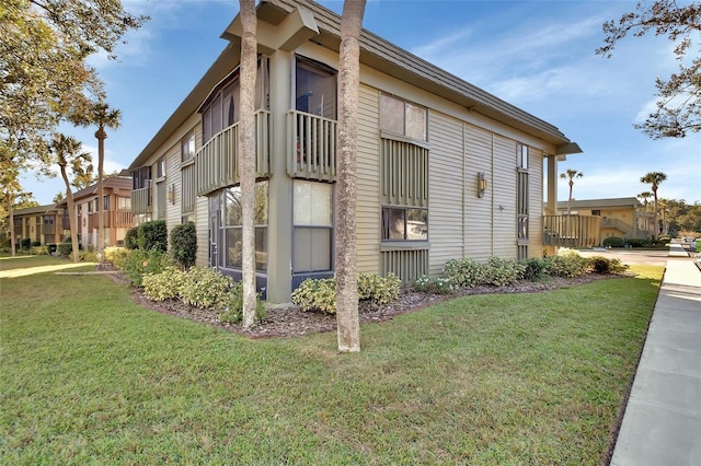 view of property exterior featuring a lawn