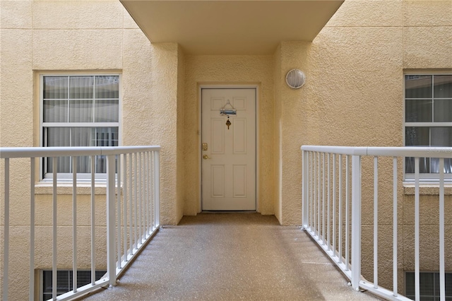 entrance to property with a balcony