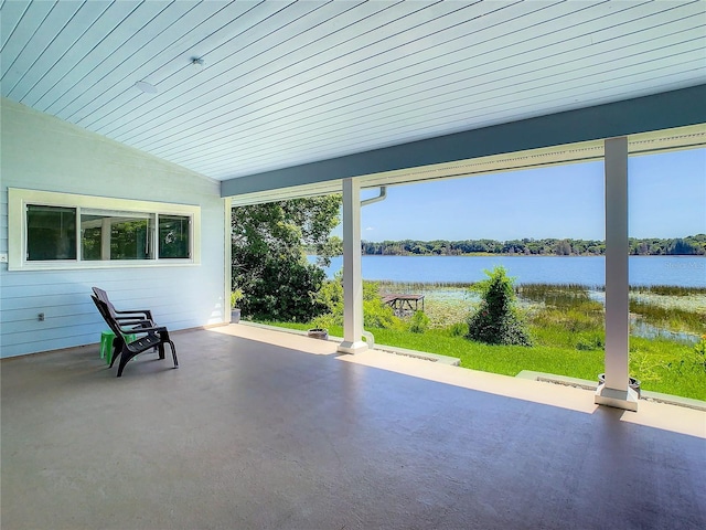 view of patio with a water view