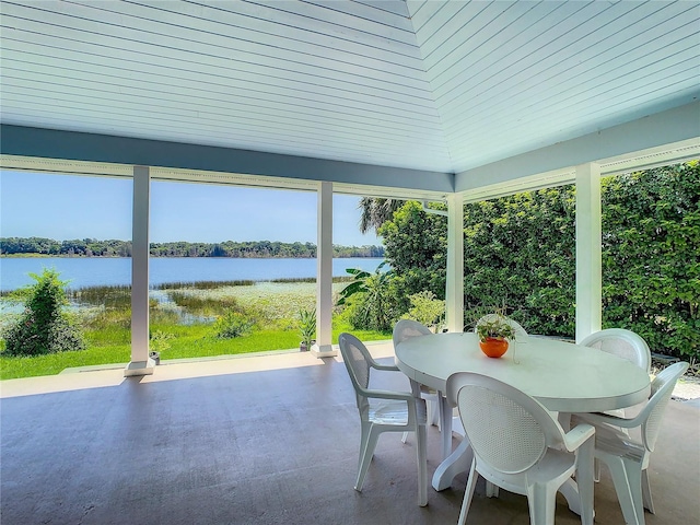 sunroom featuring wood ceiling, a water view, and plenty of natural light