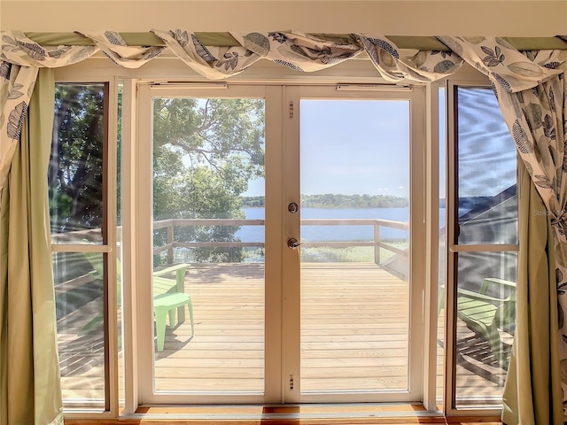 entryway with a water view and french doors