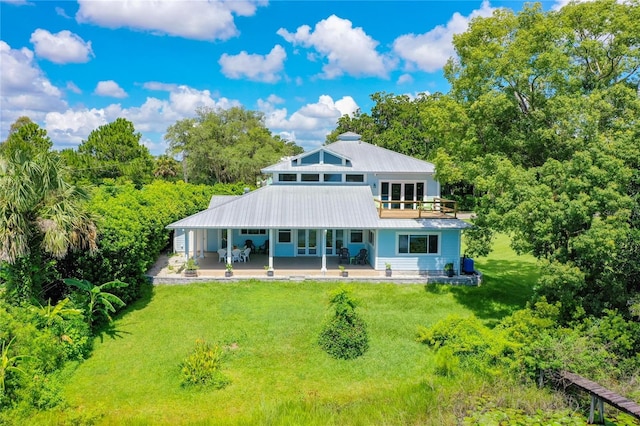 rear view of house with a lawn