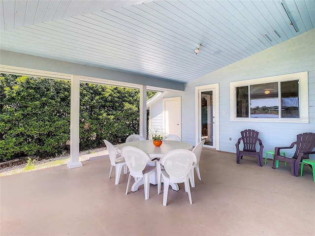 sunroom featuring wooden ceiling and lofted ceiling