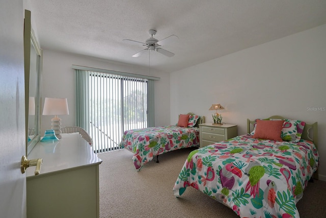 carpeted bedroom with ceiling fan and a textured ceiling