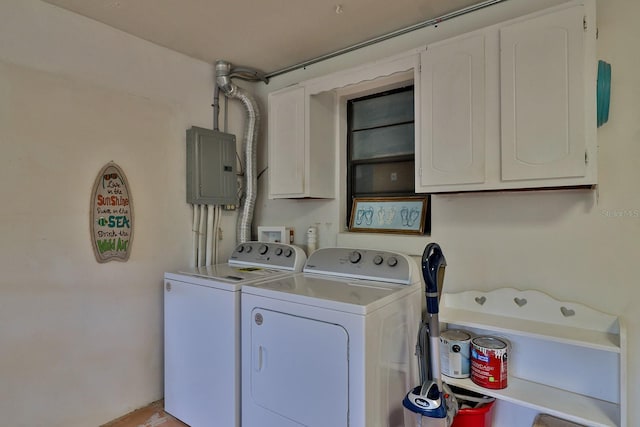 laundry area with cabinets, independent washer and dryer, and electric panel