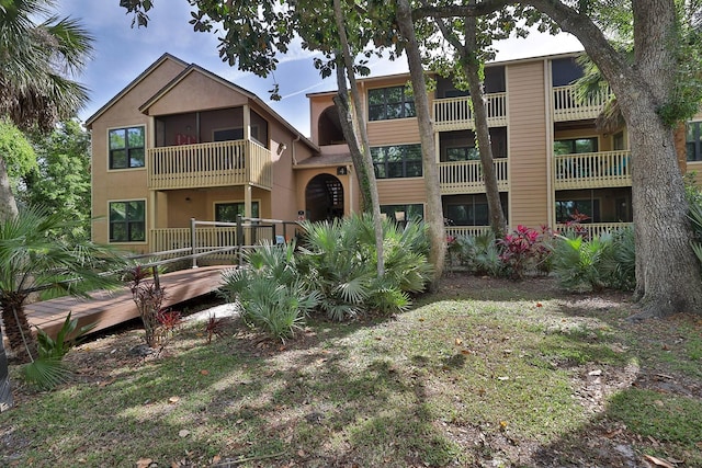 rear view of property with a balcony