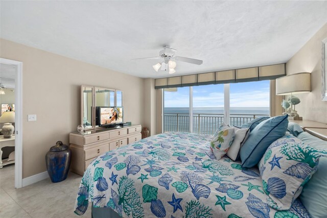 tiled bedroom featuring access to outside, ceiling fan, and multiple windows