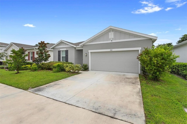 ranch-style house featuring a garage and a front yard