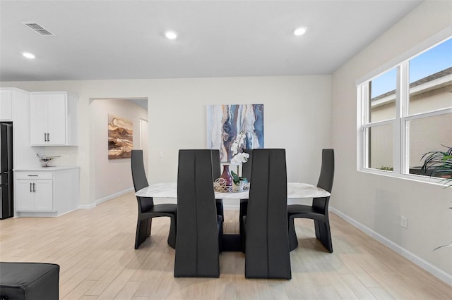 dining area featuring light hardwood / wood-style flooring